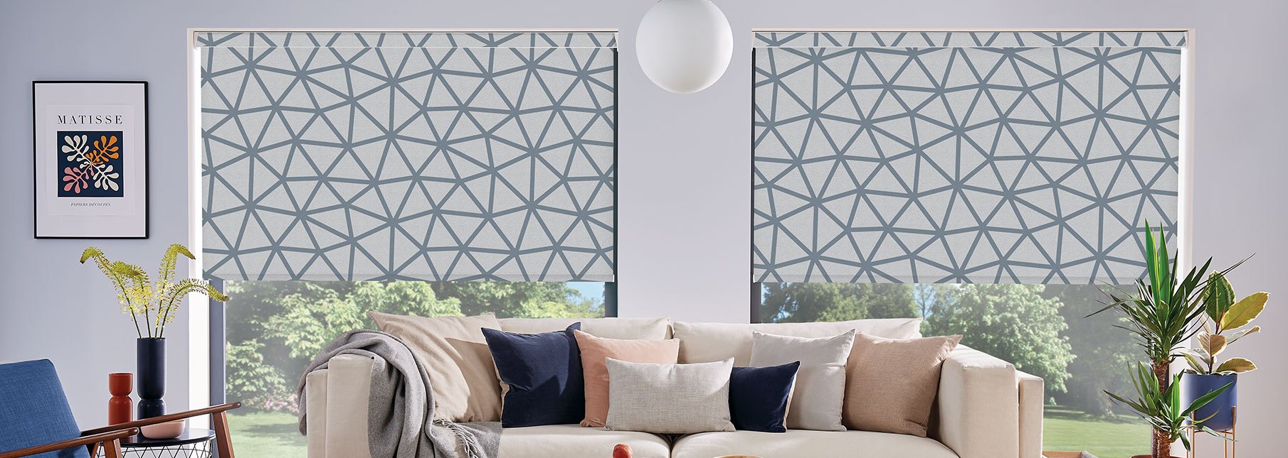 Geometric print roller blinds in a modern living room